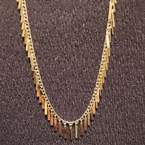 Elegant Gold Necklace with Fringe Detailing